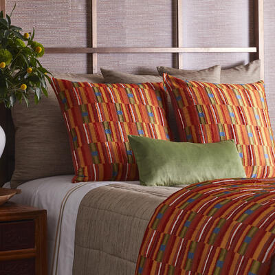 Part of The Met x Ann Gish collection, Pluma reinterprets the feathered mini tunics of the Ica people as vibrant embroideries, expanding the shades and textures of these traditional garments in either a multicolor of warm reds and oranges with flecks of green and blue or a rich green with fringe detail. Available as a duvet, pillows and throw in Green and Multi (shown). 60% linen, 40% cotton