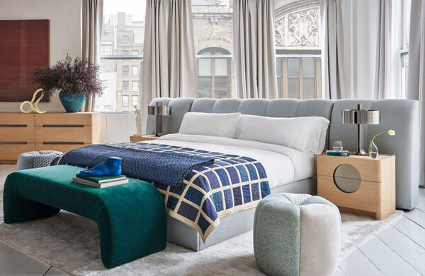 From the Rafael de Cárdenas for MG+BW Home collaboration: Horizon bed with optional headboard extensions, Full Moon two-drawer nightstand and dresser, Beam bench in Teal mohair velvet and Lily pouf