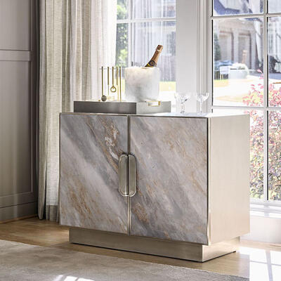 The Mercer storage chest exemplifies natural beauty in a modern way—engineered stone gives the look of Palissandro Bluette marble without the weight. Media console also available