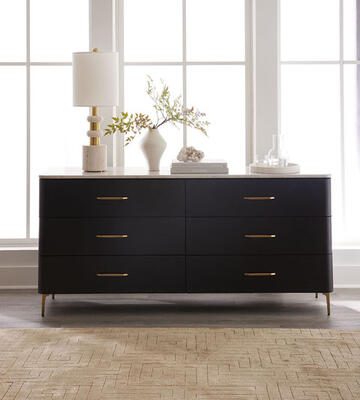 The Ashmont dresser offers elegant storage with its ash frame and richly patterned wood-grain marble top. Nightstand also available. Shown with MG+BW exclusive Dawson rug and Cornell travertine lamp
