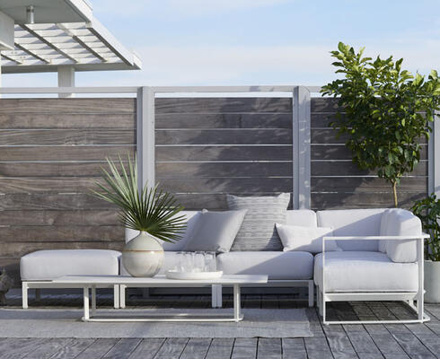 From the MG+BW outdoor collection: Sanibel five-piece sectional, shown with White cast-aluminum frame and cushions in Oyster performance plain weave. Also available in Zinc cast aluminum