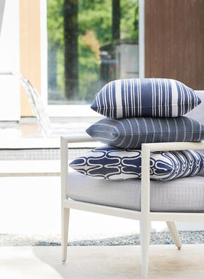 Chair cushion in Savile fabric, Pillows (from top to bottom): Kaia Stripe, Ebro Stripe and Saraband
