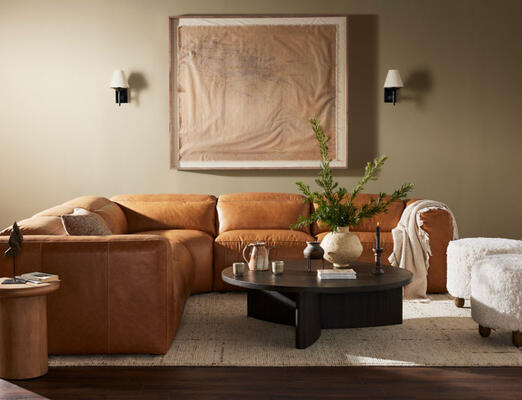 A modern take on the classic recliner sectional in top-grain leather with discreet push buttons, exclusive to Four Hands