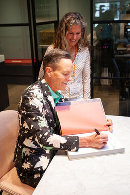 Ken Fulk signing a copy of his book, published by Assouline