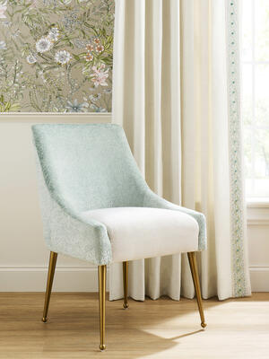 A chair upholstered in fabrics from the Water palette