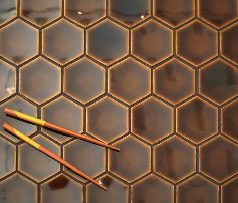Godai series glazed porcelain concave hex in Burnt Umber from the Zen+Clay collection, Heritage Tile