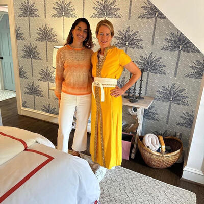 Paula Cushman of Casa by PC and Stacy Kunstel of Dunes and Duchess in the master bedroom featuring Casa by PC wallpaper
