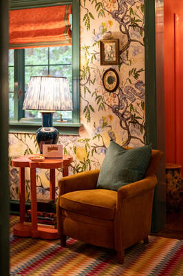 The den featuring wallpaper from Ferrick Mason, shades with Schuyler Samperton fabric and 33 chairs from Moore & Giles