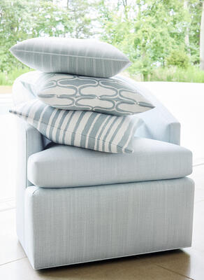 Dexter Chair in Savile woven fabric. Pillow (from top to bottom): Ebro Stripe, Saraband, and Pintado Stripe. 