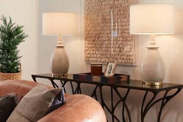 Left to right: Makenly lamps, Tarni wall art, Emily tray set, Aldrich console, Caldwell sofa