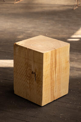 The Hyo side table in its natural color is a beautiful pine wood cube that exudes understated elegance.