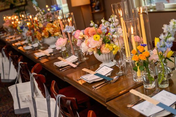 Guests enjoyed a three-course meal among tall taper candles and florals