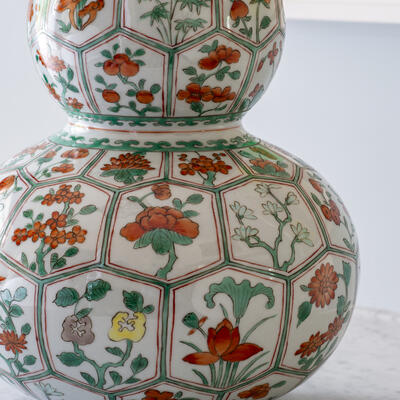 This colorful lamp is produced in an underglazed hand-decorated porcelain 