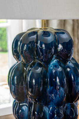 The semitranslucent blue glaze adds depth to the finish on the Chablais table lamp 