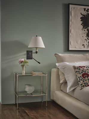 The Bordon swing arm reading wall light, available in brass or bronze, is the perfect bedside fixture, with a flush backplate, single swing arm and the practicality of a flexible reading light