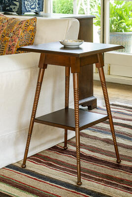 Inspired by the aesthetic movement of the late 19th century, the Nutley table has two tiers and turned bobbin legs