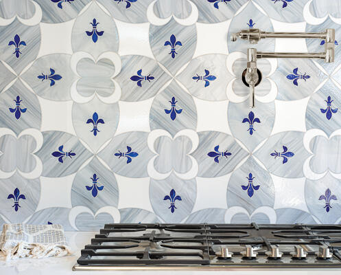 Ile Saint-Louis, a waterjet glass mosaic shown in Absolute White, Pearl and Lapis Lazuli, is part of the Ville Lumière collection by Caroline Beaupère