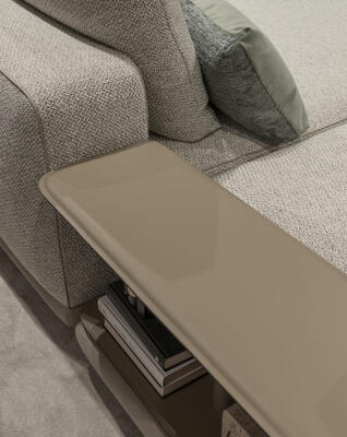 The Skyline sofa features an integrated, saddle leather–wrapped side table