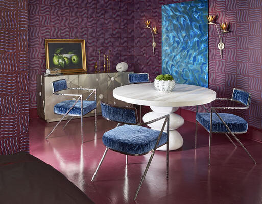The dining area featured the Navar dining table, Torres chairs and Stellar entertainment credenza, all of which were enveloped by a custom Blue Burgundy Wash wallpaper by Forbes Masters