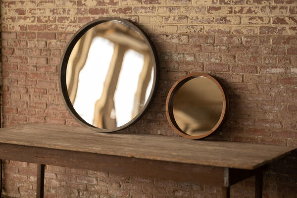 The Rita mirror boasts layered joinery to create a deep solid urban wood frame to emphasize space in small or large rooms. Either size can add beauty and purpose to an entry way, a bathroom above a vanity or the room of your choice for texture and delight.