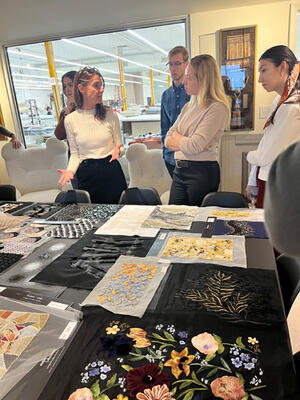 After the tour of Jouffre, field trip attendees view custom embroidery and fabric samples from Ateliers Lison de Caunes