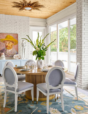 Custom Anders dining table, Emma dining chair, Poppy Turkish knot rug, “Paper Vince” artwork