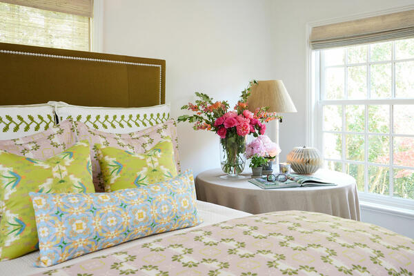 Bedding in Primrose Mauve. Accent pillows in English Garden Citron and Chelsea Orange