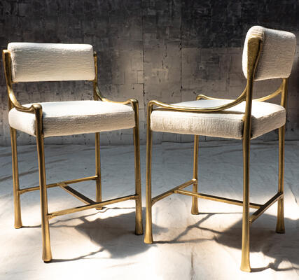 Giac counter stool: The Giac collection is defined by its sinuous cast-aluminum frames and elegant forms, making its seating designs a chic option for dining scenarios