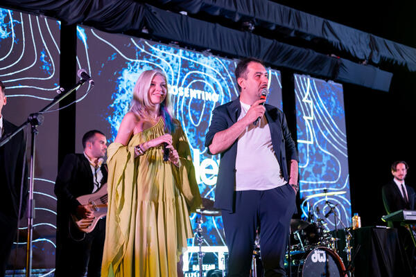 Natasha Shtapauk and Eric Mnat on stage at the C.Next Designers after-party with Bauteam