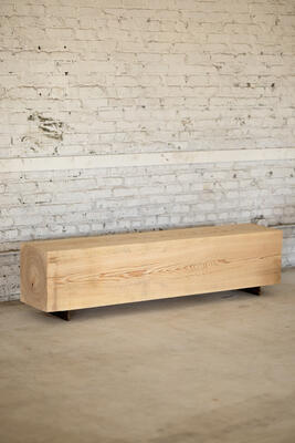 Our wood beam bench in cypress utilizes salvaged wood logs for a rustic seating experience. Narrow and backless, the simple lines express the natural texture of the end grain. The 15" x 15" beam is milled and finished to sit on a Corten steel base. With an emphasis and respect for natural materials, the beam bench brings primitive beauty and quiet luxury at a variety of lengths. 