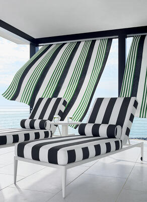 Outdoor panels in Riviera Stripe fabric, cushions and lumbar pillows in Cabana Stripe fabric