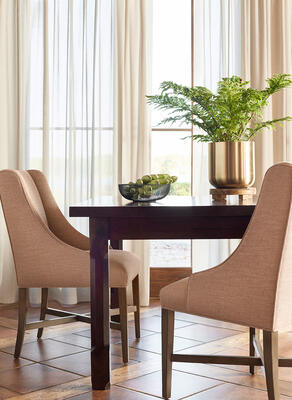 Drapery panels in Daphne fabric, Thibaut Fine Furniture Hayden dining chairs in Finley fabric