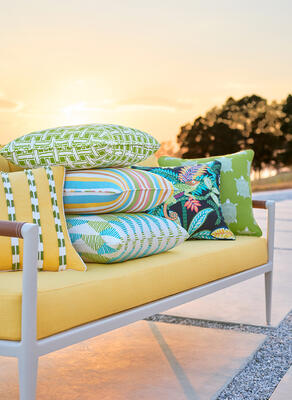 Cushion in Brynn fabric, pillows in Turtle Bay, Iggy, Kalea Stripe, Brynn with Easton fringe, Panama Matelassé and Harper fabrics 