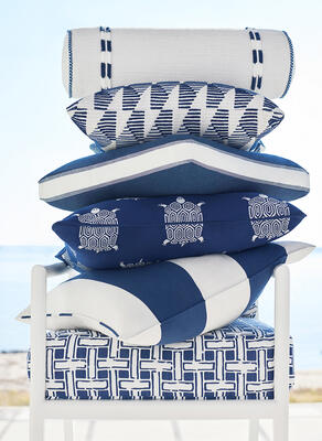 Cushion in Panama Matelassé, lumbar pillow in Cameron fabric with Easton fringe and Surrey cord, pillows in Harper, Tessa with Nordia tape, Turtle Bay and Cabana Stripe fabrics