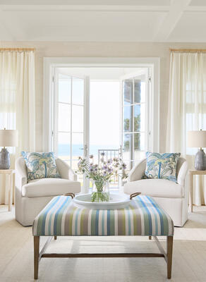 Bethany Raffia wallcovering, drapery panels in Asher fabric, Thibaut Fine Furniture Dexter chairs in Silas fabric, pillows in Iggy fabric, and Thibaut Fine Furniture Addison bench in Kalea Stripe