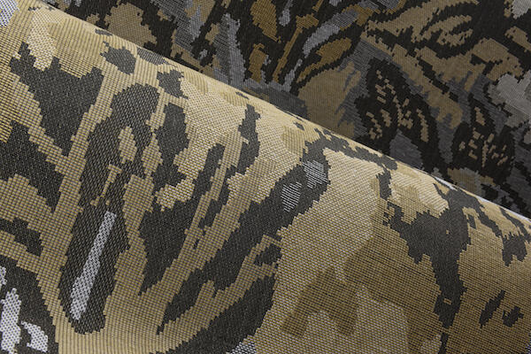 Riverbank: Inspired by classic tapestries, this woven jacquard wallcovering depicts a lush riverbank with a Japanese crane peeking out of the vegetation. This distinguished species symbolizes good luck and longevity in Japan. The drawing is intentionally pixelated in a nod to the country’s midcentury optimism. Riverbank is available in three colorways