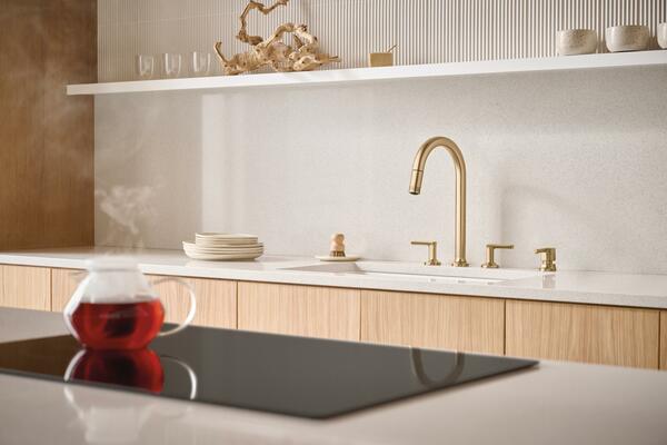 The new two-handle configuration combines the ease of a pull-down wand with the elegance of a statement-making widespread faucet