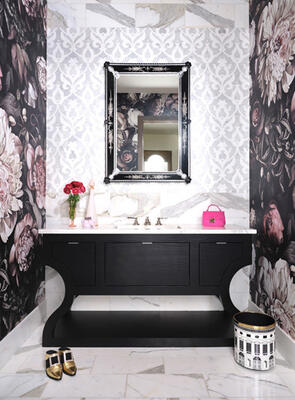 Powder rooms are some of our favorites to design -- an opportunity to be bold and playful, a chance to introduce a wonderful surprise. Here, a custom floral wallpaper, enlarged by 220 percent, brings some flair to the marble surround, while the black vanity and Venetian mirror anchor the space within the context of the larger home. 