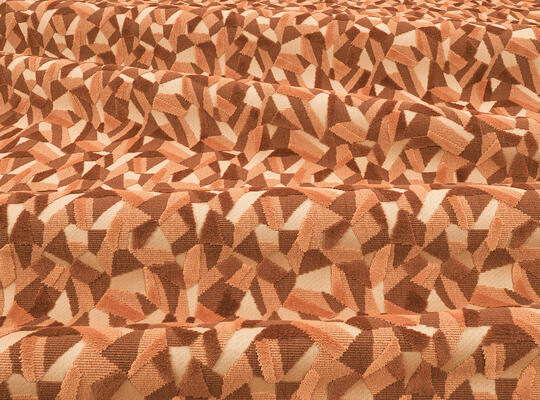 A sustainable cut and uncut velvet for interiors woven from 63 percent recycled cotton. A graphic design influenced by bird’s-eye views of crop fields. Jagged shapes in a mix of textures come together in one statement pattern: Aerial