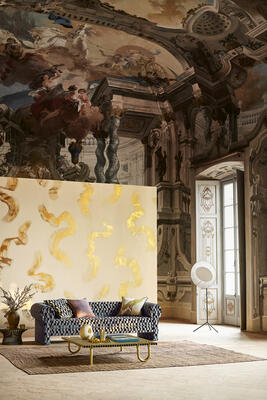 An immersive visual experience, the Tsauri mural, shown here in Gold, is both captivating and exquisite. Majestic in nature and artistic in form, bold printed brushstrokes embellished with shimmering gold foil command attention in three-dimensional splendor, occurring dynamically across the wall in a grand spectacle, rising with tactile prominence from the fine, silk-like background