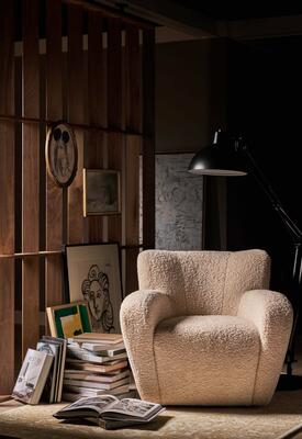 The Marla chair, reminiscent of a comforting teddy bear with its highly textured fabric
