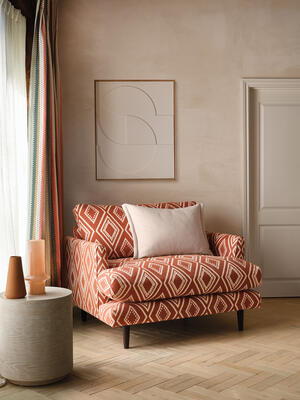 A contemporary statement, this bold and beautiful, large-scale diamond design is softened by a fine ikat-effect edge and single use of color. Toulin is printed on the iconic Linara brushed cotton linen, with its classic peach-skin finish adding a charming tactility to the design