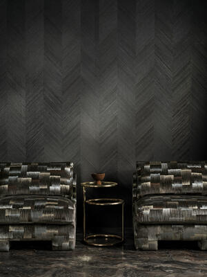 The unmistakable glimmer of foil peeks through diagonal strips of paper to create Baryte, a large-scale herringbone-stripe wallcovering