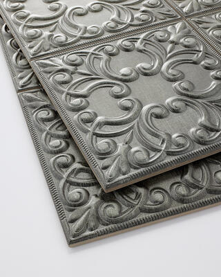 Trend 05/14, Textured Metallics: Tin tiles became popular in the mid-1800s as middle-class Americans sought to imitate the elegant sculpted plaster ceilings in upscale European homes. Tin-look tiles feature a decorative raised surface that mimics the designs used in traditional Victorian tiles 