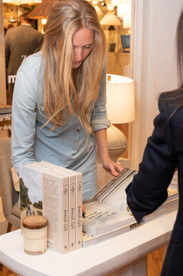 Designer and author Lauren Liess inscribes her book for a guest