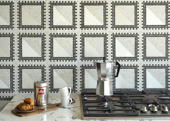 Pietro, a hand-chopped and waterjet-cut mosaic, shown in tumbled Calacatta Monet, polished Calacatta Monet and Orpheus Black