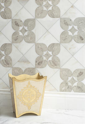 Zilia, a waterjet-cut mosaic, shown in honed Calacatta Monet, Palomar and polished Stratus