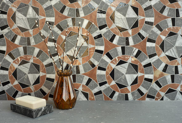 Giacomo, a waterjet-cut mosaic, shown in polished Rojo Alicante, Thunderhead, Dahlia and honed Basalto Orvieto