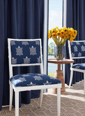 Drapes in Liam woven fabric and Nordia Tape. Thibaut Fine Furniture Greenwich Dining Chairs in Turtle Bay woven fabric. 