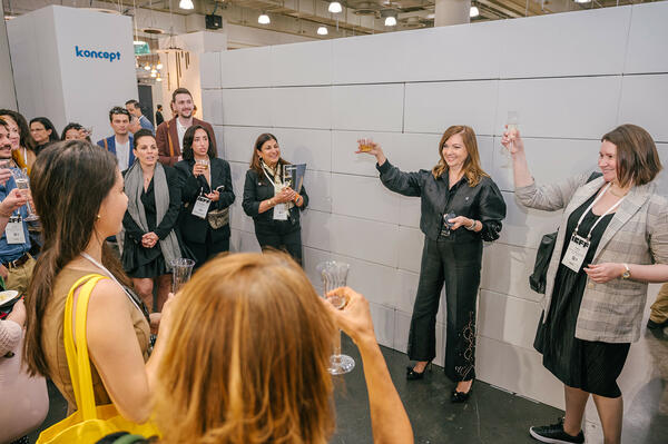 Lauren Rottet leading a group toast to the IIDA New York chapter and New York Design Week